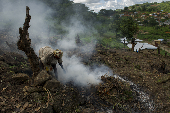 Near Kabala in the Northern Province, a farm family slashes and burns their property to clear the land for peas and cassava.